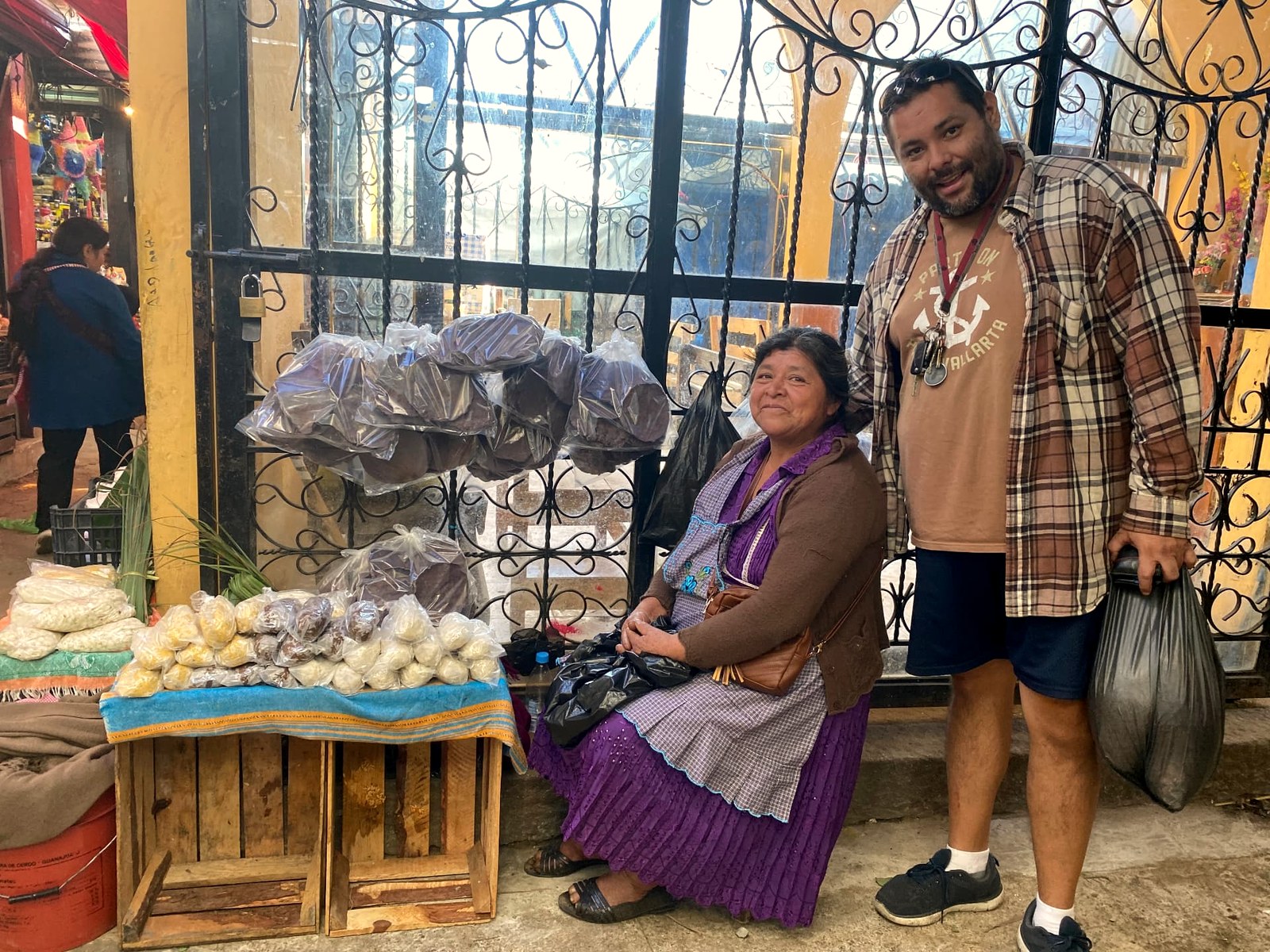 Chef Alfonso with a producer at a traditional market stall